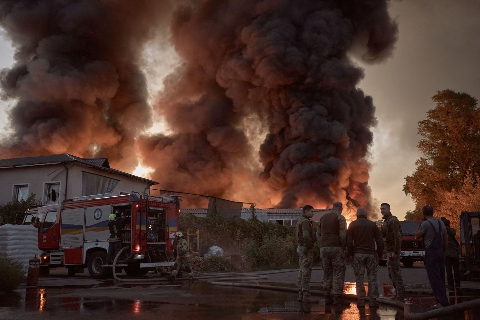 Members of emergency services work to contain a fire in the aftermath of a Russian missile and drone attack in Kyiv, Ukraine, on Sept. 8, 2026.