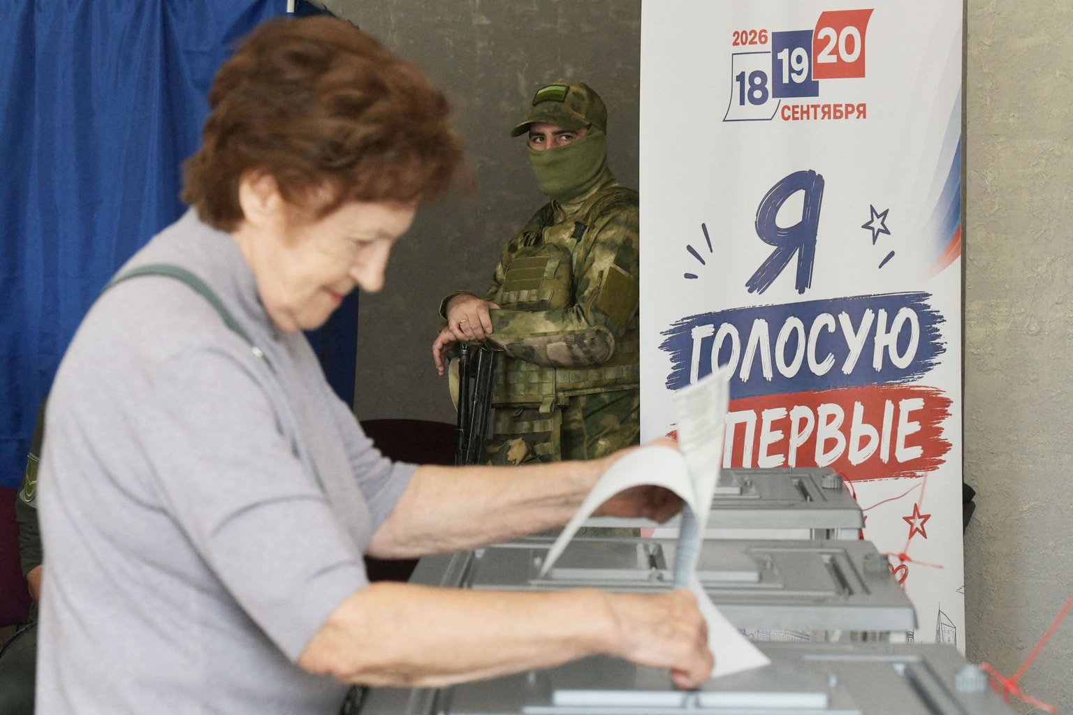 A woman casts her ballot at a polling station in Donetsk, Russian occupied part of Ukraine, on September 20, 2026.