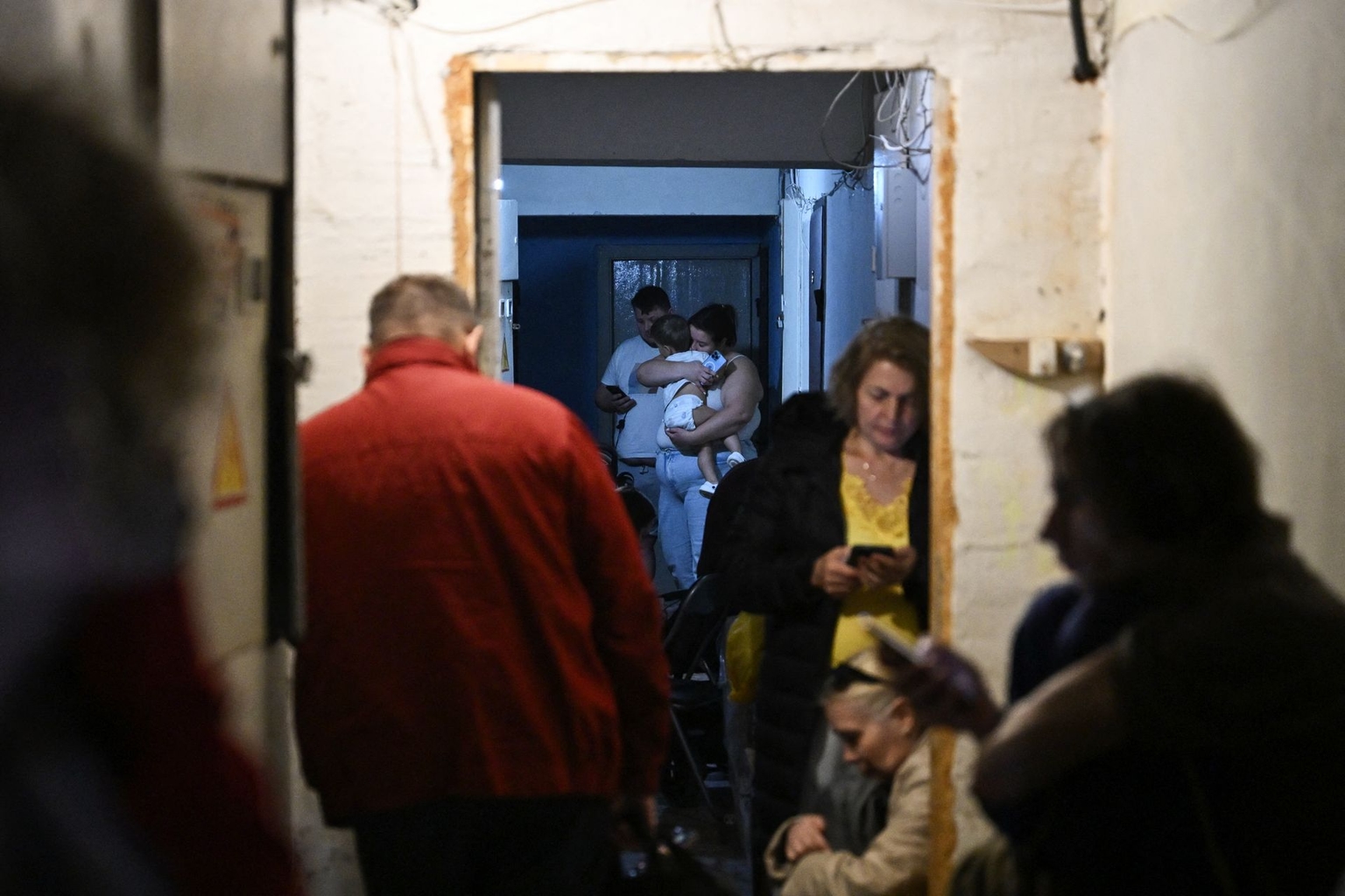 Local residents take shelter during an air attack in Kyiv, Ukraine, on Sept. 23, 2026.