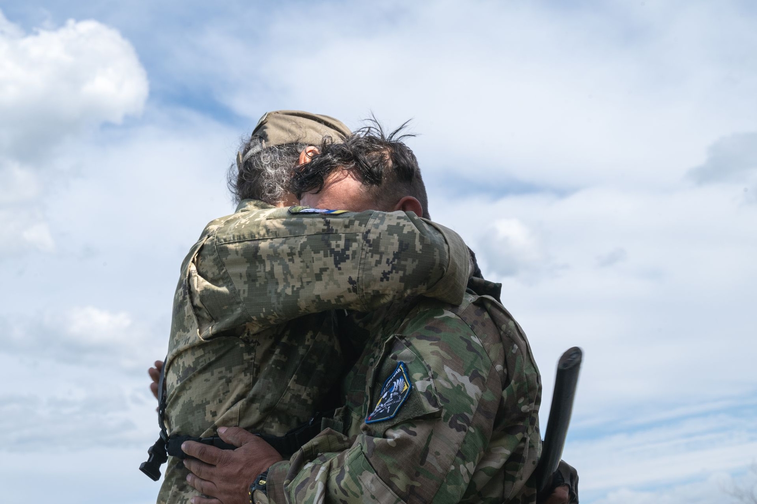 Colonel Jose David Chaparro hugs a soldier in Mykolaiv Oblast, Ukraine, in May 2026.
