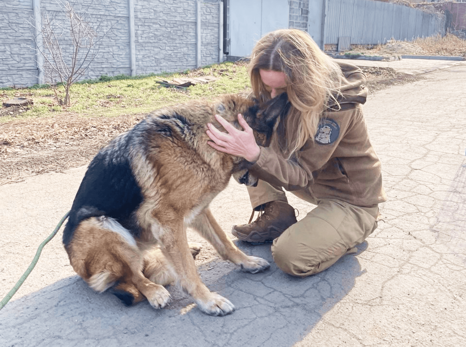 12 Vartovykh volunteer and a dog the orgnization rescued