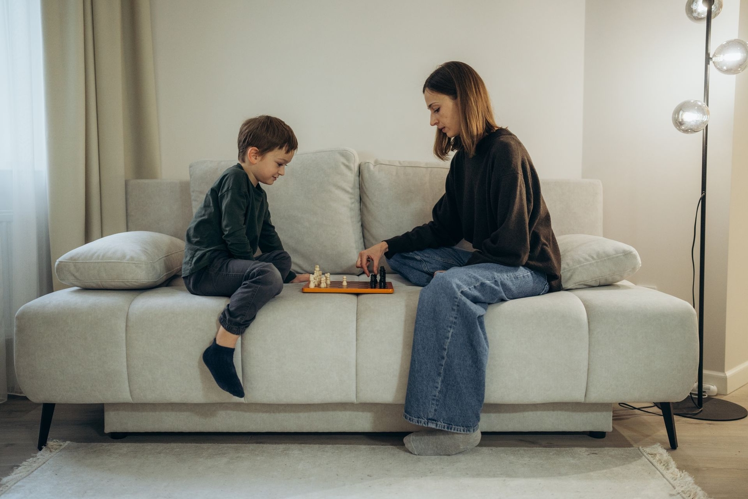 Anna Lodyhina plays chess with her 5-year-old son, Yukhym, at their home in Lviv, Ukraine, on Oct. 18, 2026.
