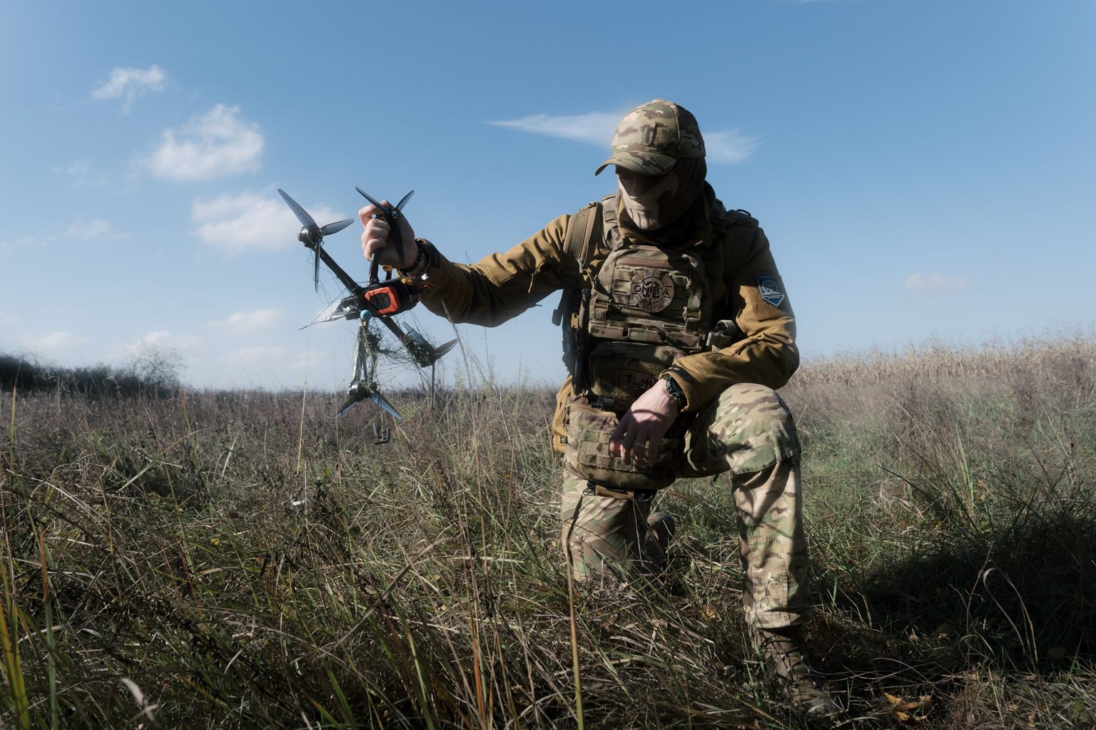 A Ukrainian National Guard soldier holds an FPV drone caught in a net in an unnamed location, Ukraine, on Oct. 20, 2026.