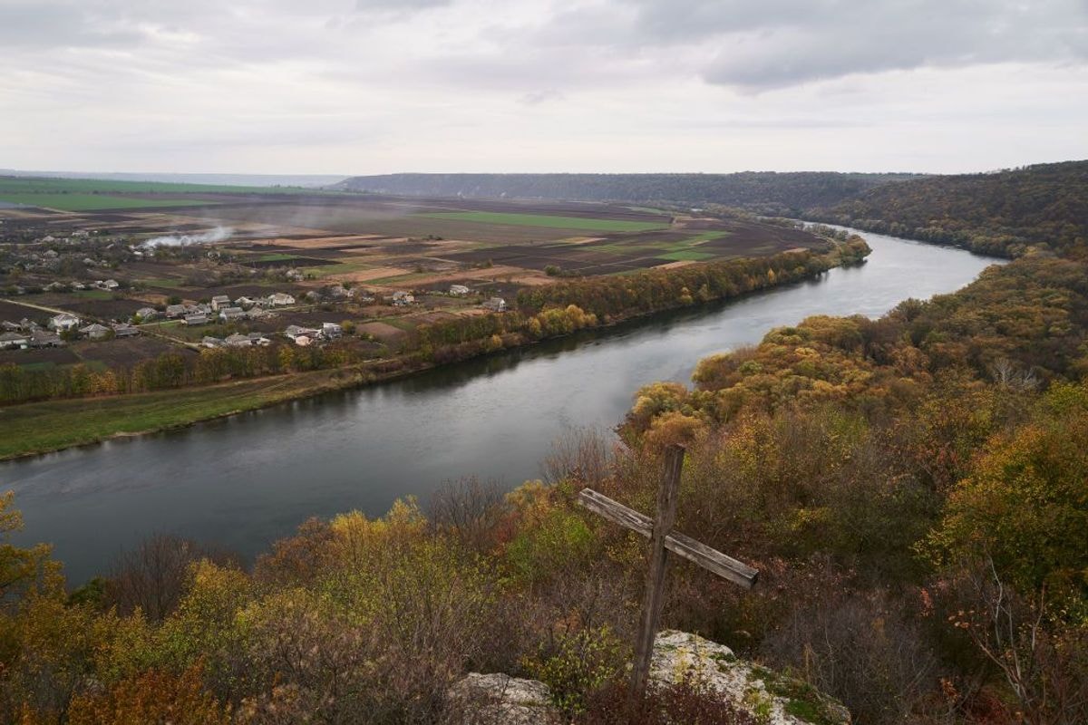 Ukraine (L) is seen on the opposite side of the Dniester River.