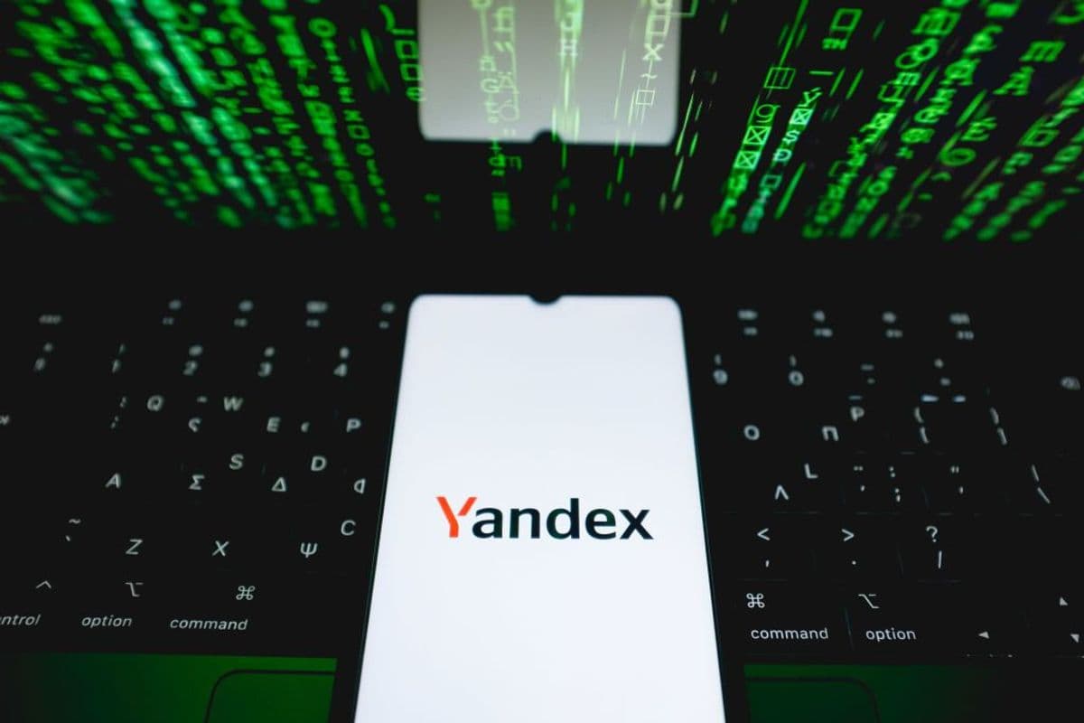 The Yandex logo is being displayed on a smartphone screen.