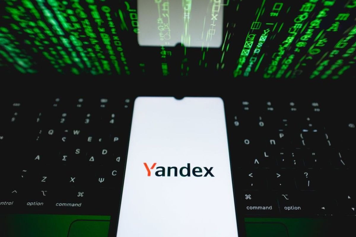 The Yandex logo is being displayed on a smartphone screen.