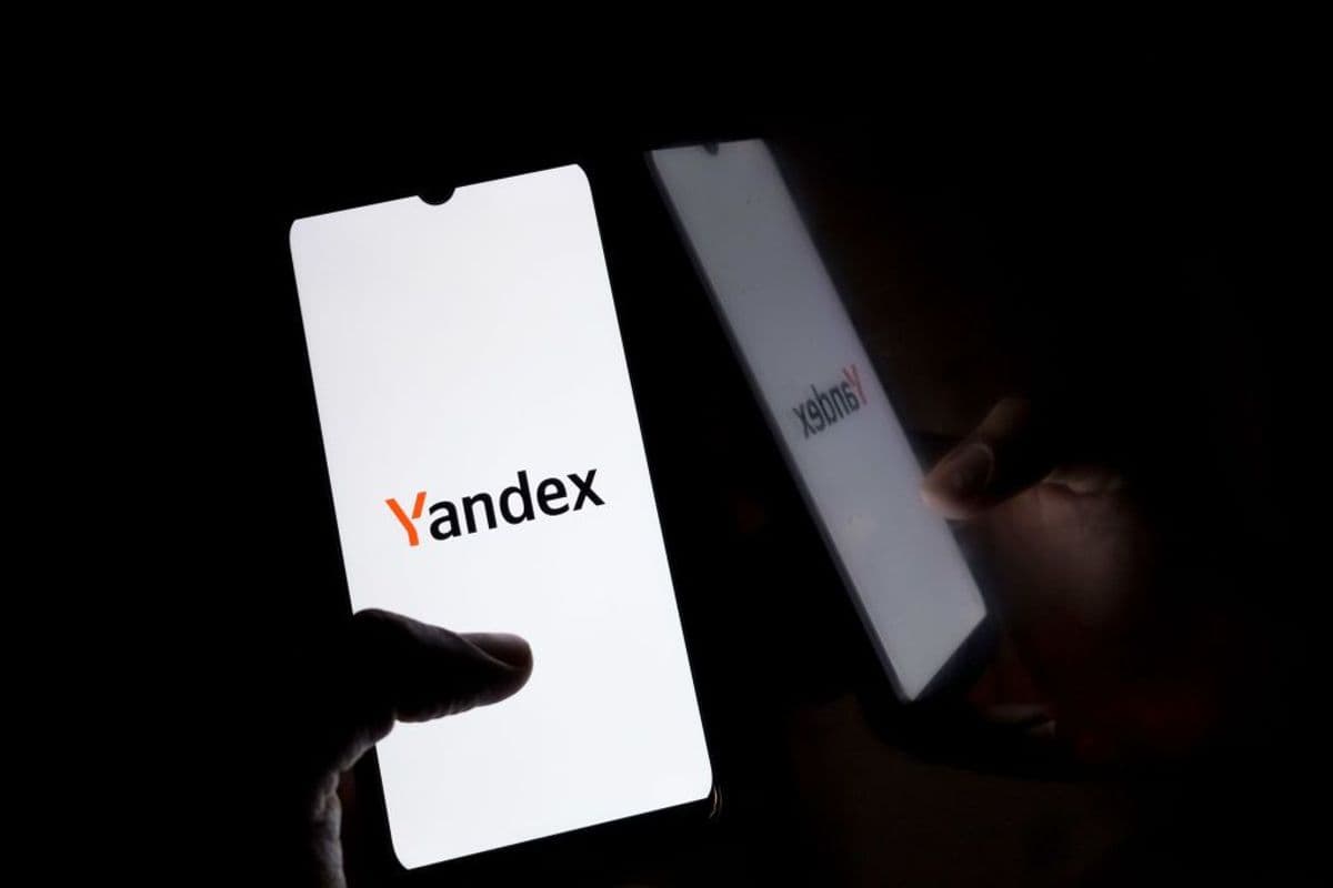 The Yandex logo displays on a smartphone screen.