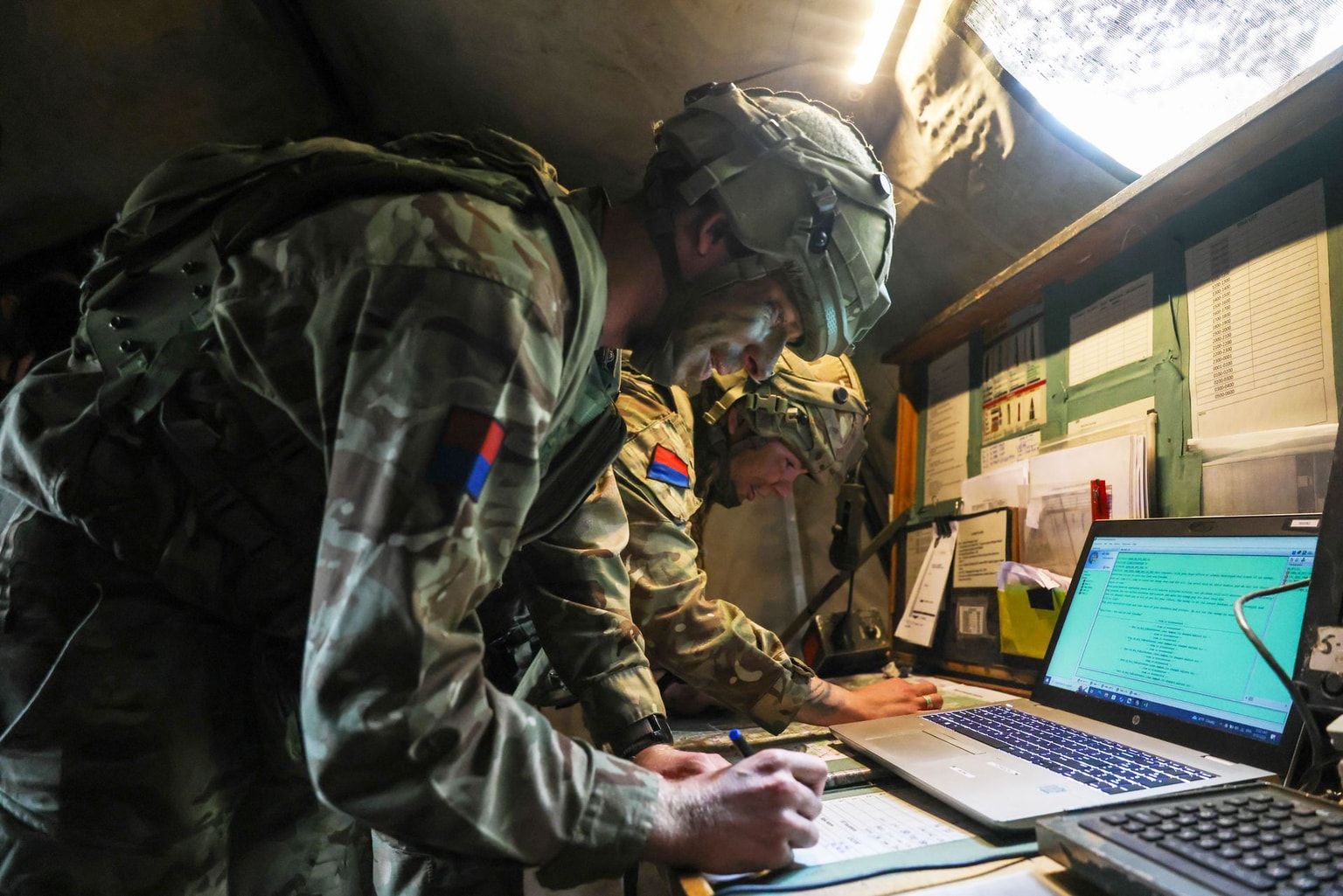 British soldiers work at a command post during a military exercise in Hohenfels, Germany, on March 12, 2025.