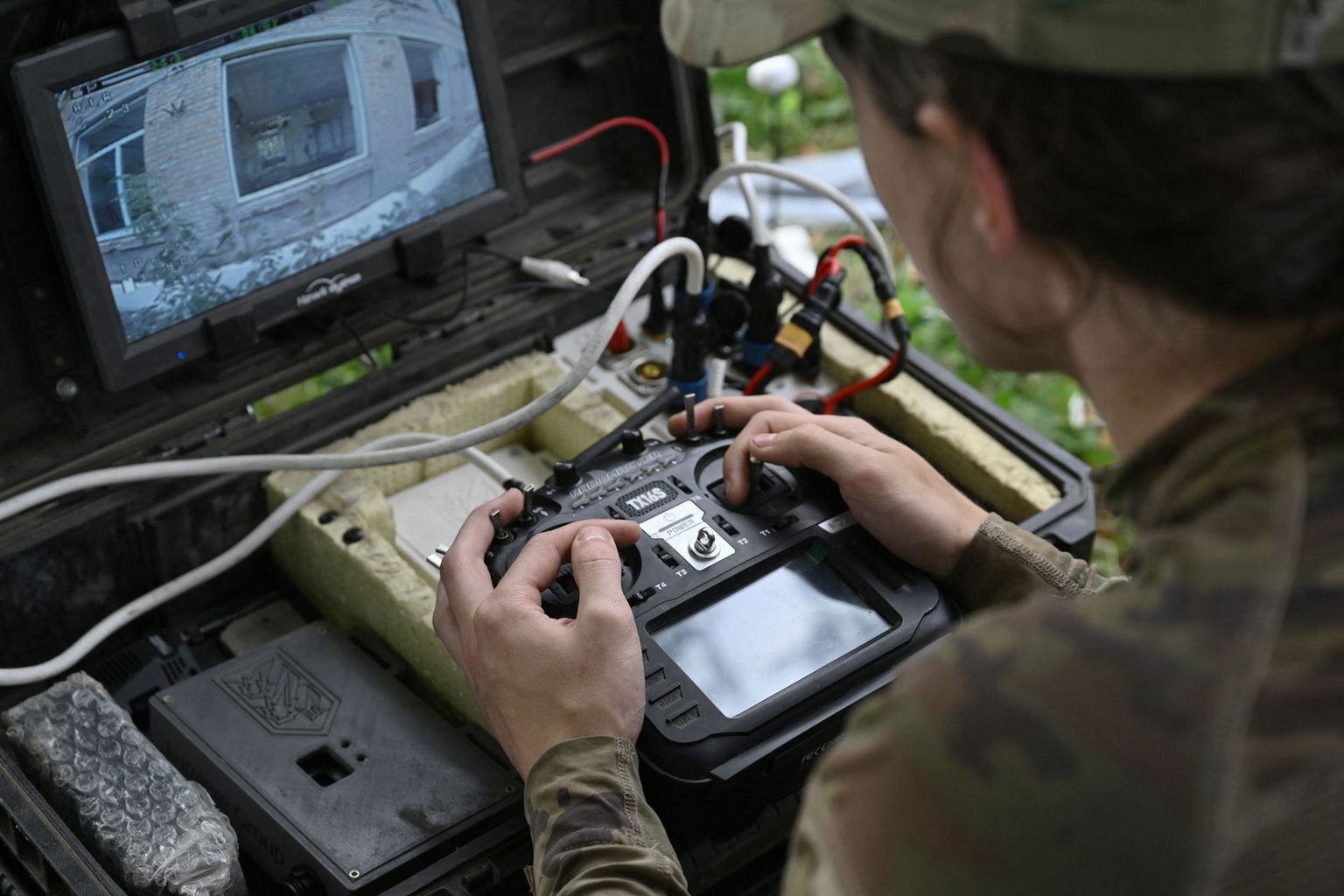 Ukrainian drone pilot Rubik operates an FPV drone during training in an unnamed location in eastern Ukraine on Aug. 12, 2025.