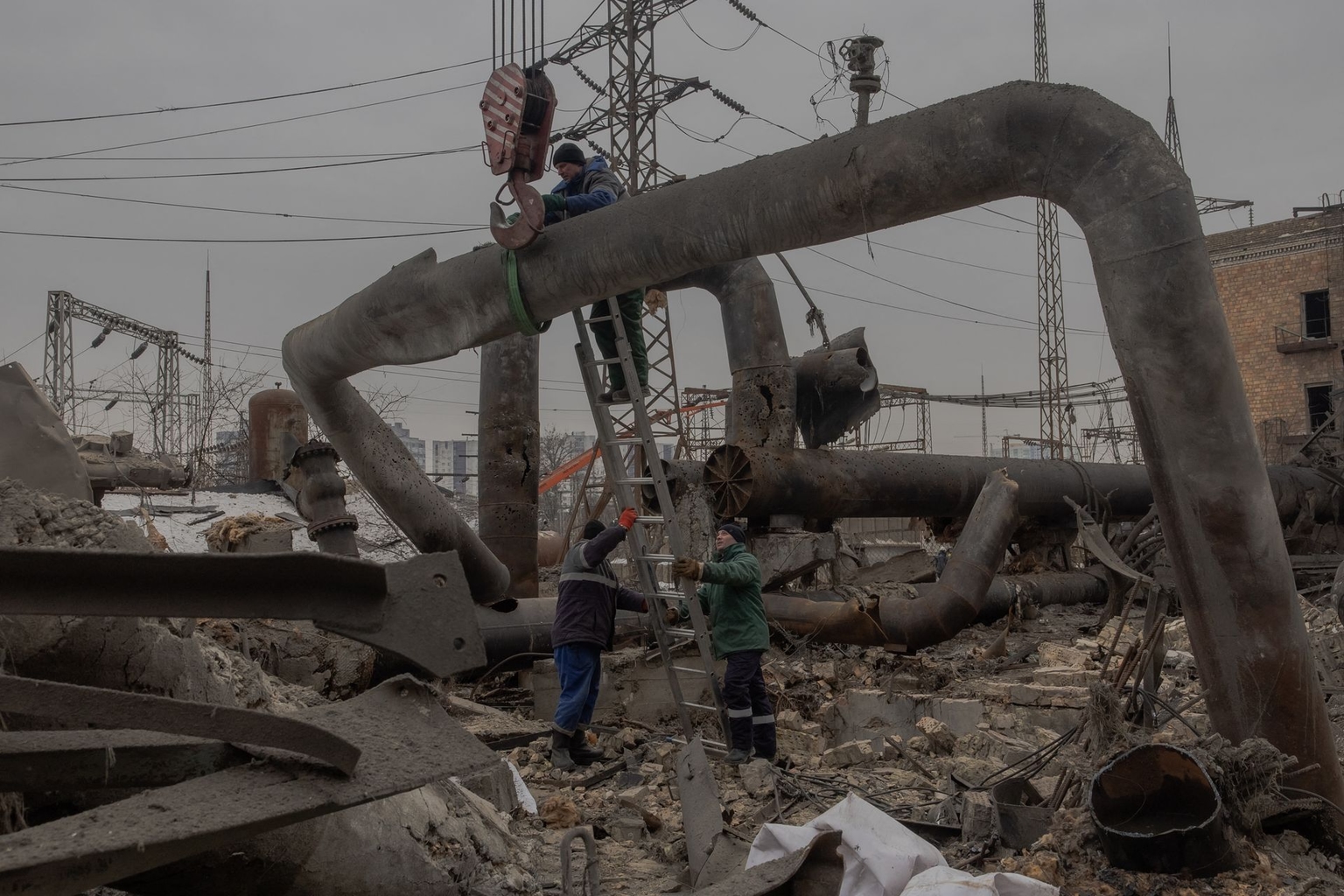 Employees repair sections of the Darnytska combined heat and power plant damaged by Russian air strikes in Kyiv, Ukraine, on Feb. 4, 2026.