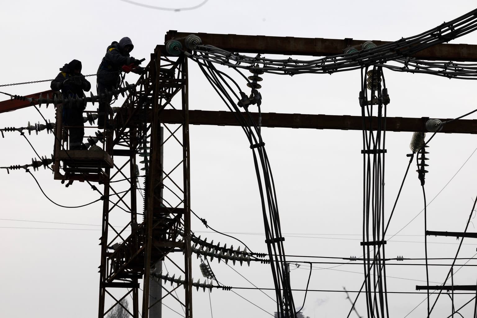 Workers repairing the infrastructure on the CHP-4 Darnytska power plant that was hit by a Russian attack.