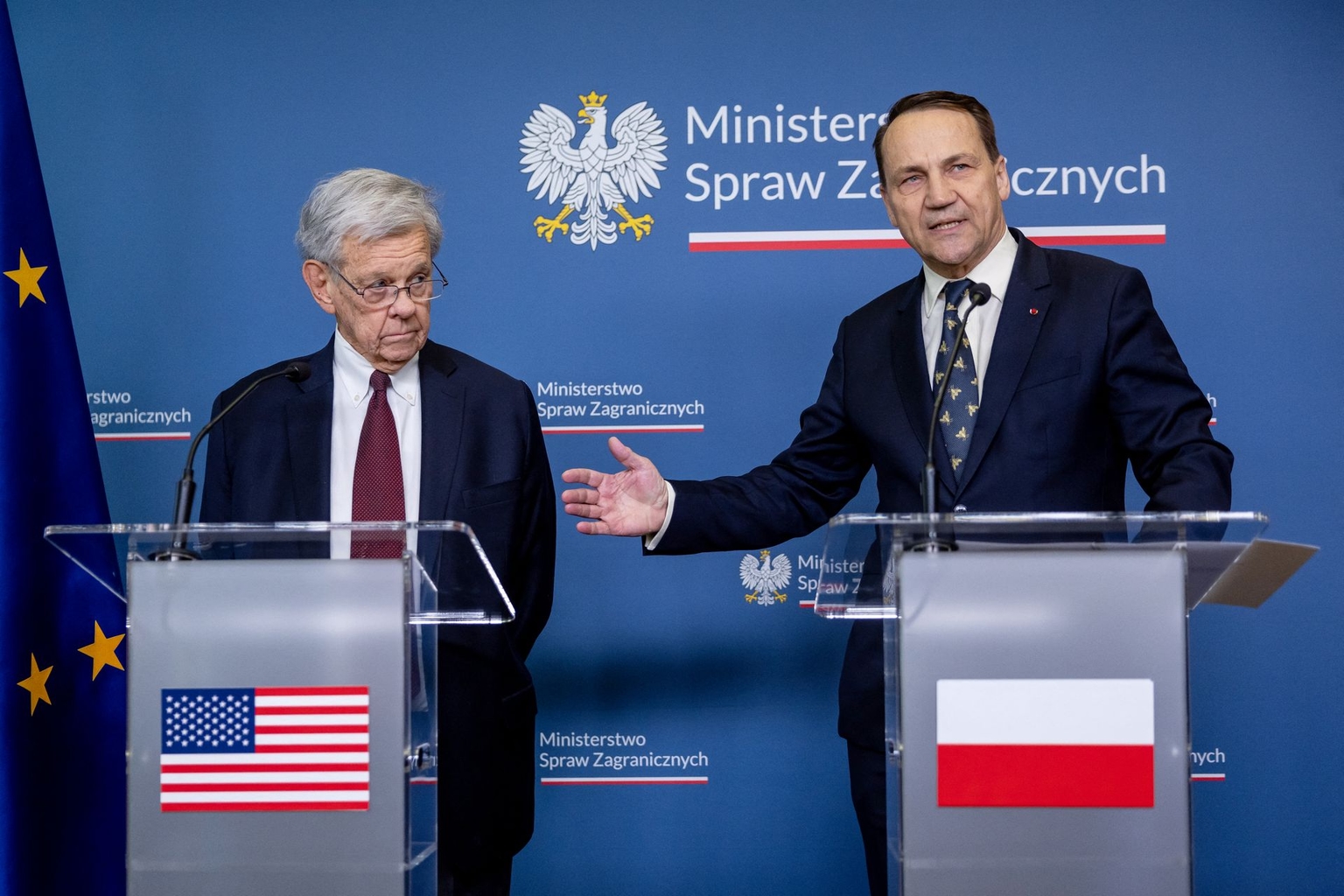 Radoslaw Sikorski and John Cole attend a press conference in Warsaw, Poland, on April 28, 2026.