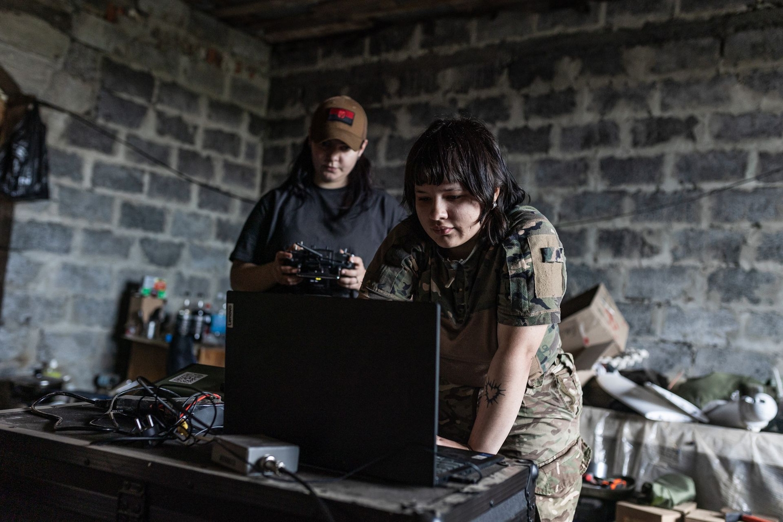 Two Ukrainian servicewomen operate a reconnaissance drone in Donetsk Oblast on June 5, 2026.