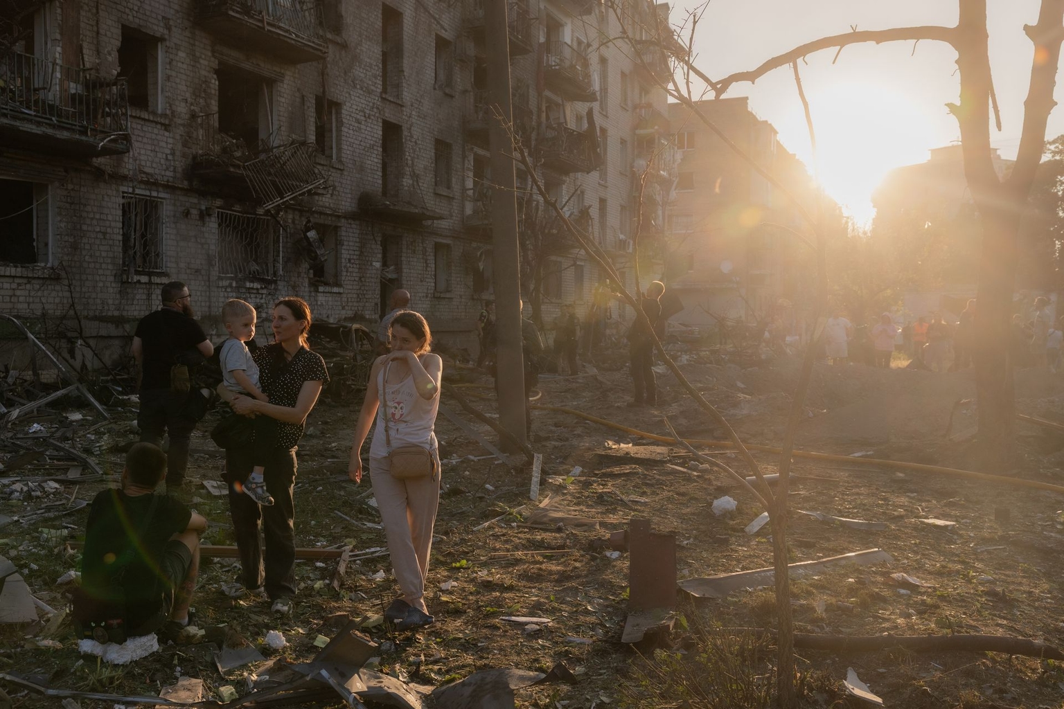 Residents gather outside a residential building damaged by a Russian air attack in Kyiv, Ukraine, on July 2, 2026.