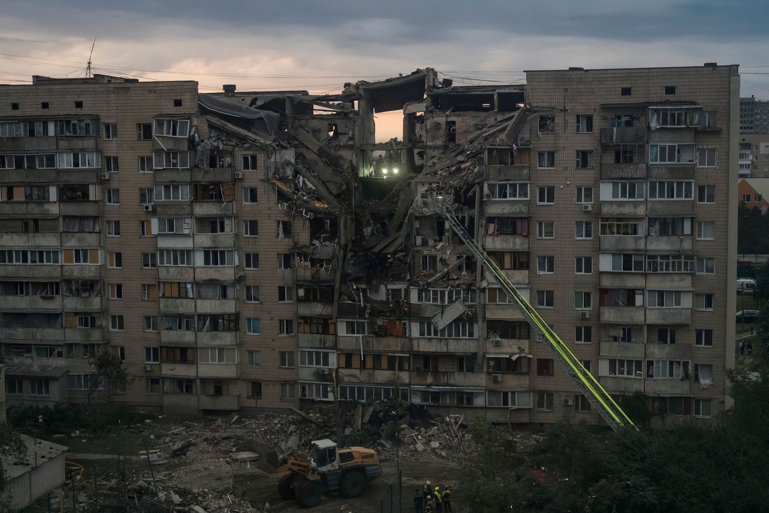 Ukrainian rescuers work at the site of a russian missile strike on a nine-story residential building in Kyiv, Ukraine, on July 6, 2026.