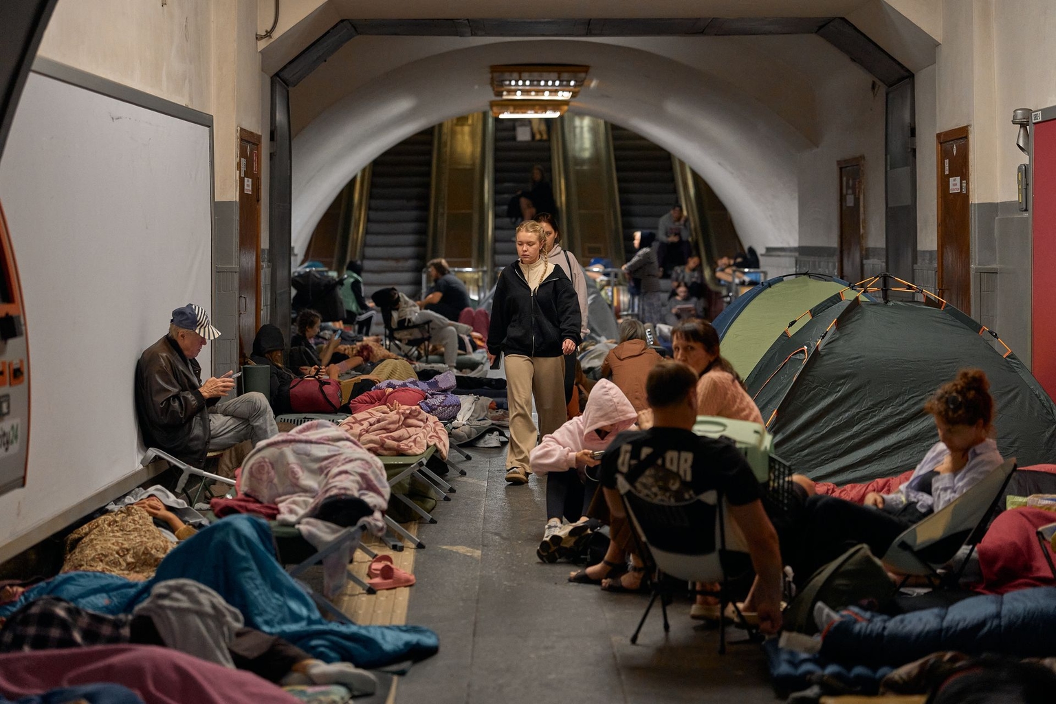 Kyiv residents take shelter inside a metro station during an air raid alert in Kyiv, Ukraine, on Aug. 20, 2026.