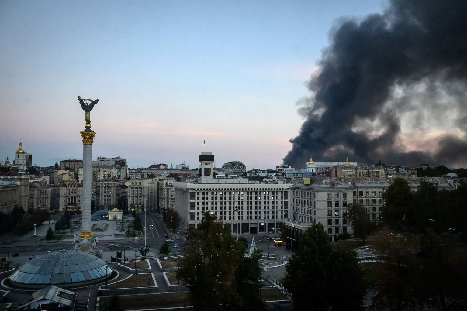 Smoke rises over buildings following Russian air attacks in downtown Kyiv, Ukraine, on Sept. 8, 2026.