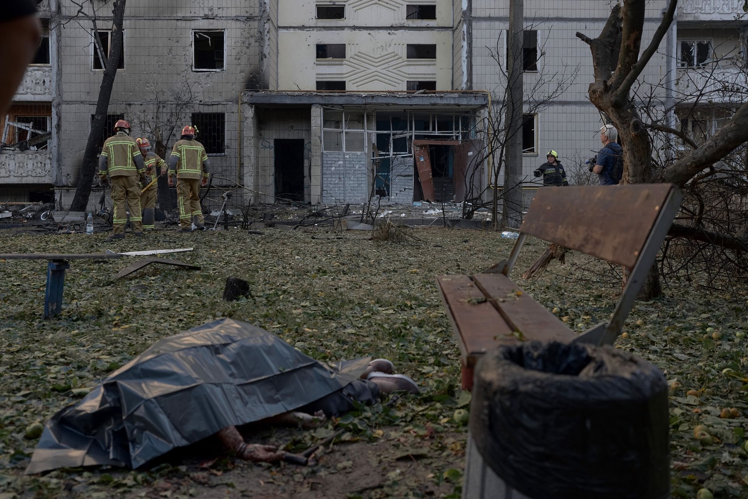 The body of a woman killed in a Russian drone attack lies outside a residential building in Kyiv, Ukraine, on Sept. 9, 2026.