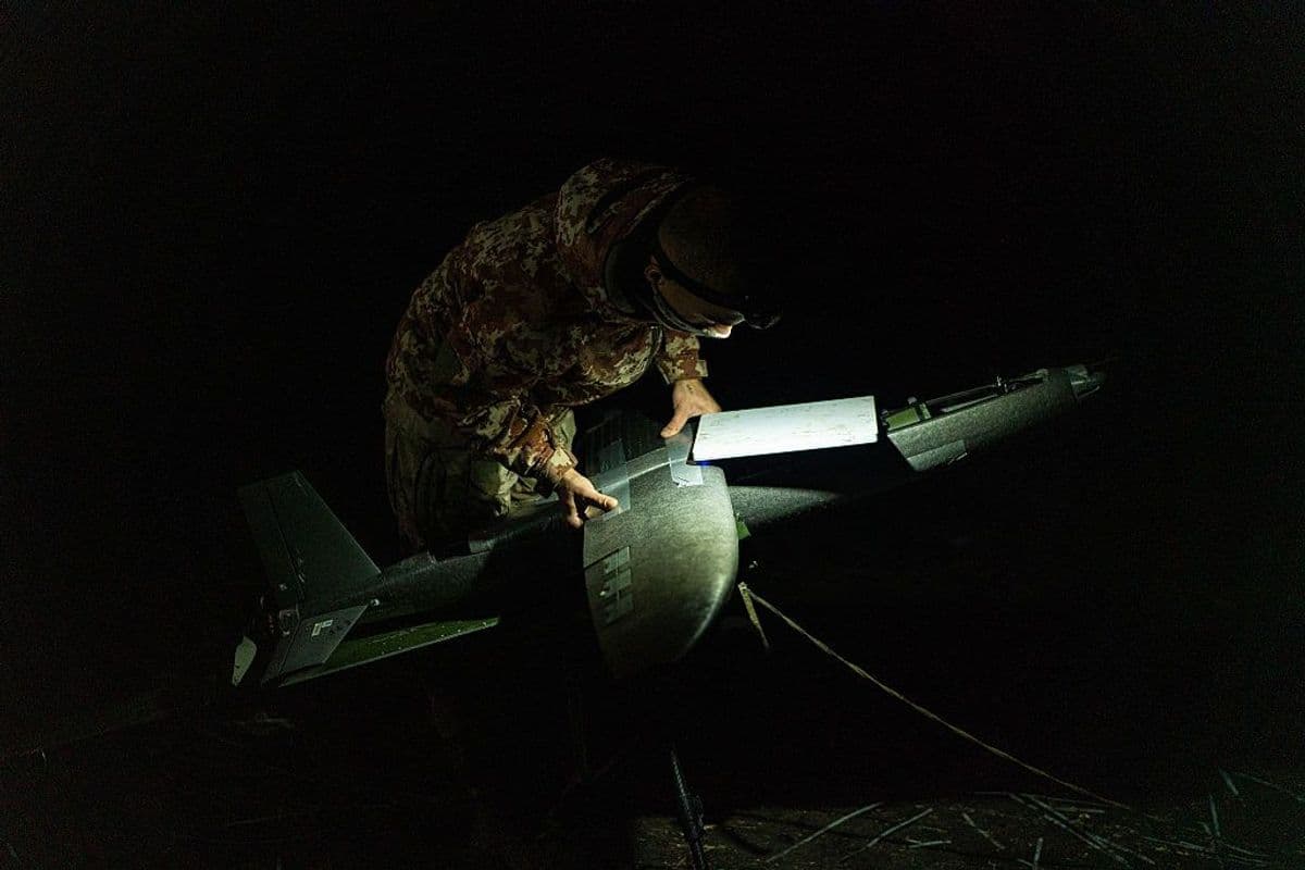 Operators of the Ronin Unmanned Systems Battalion, prepare and launch Hornet strike drones during a night operation.