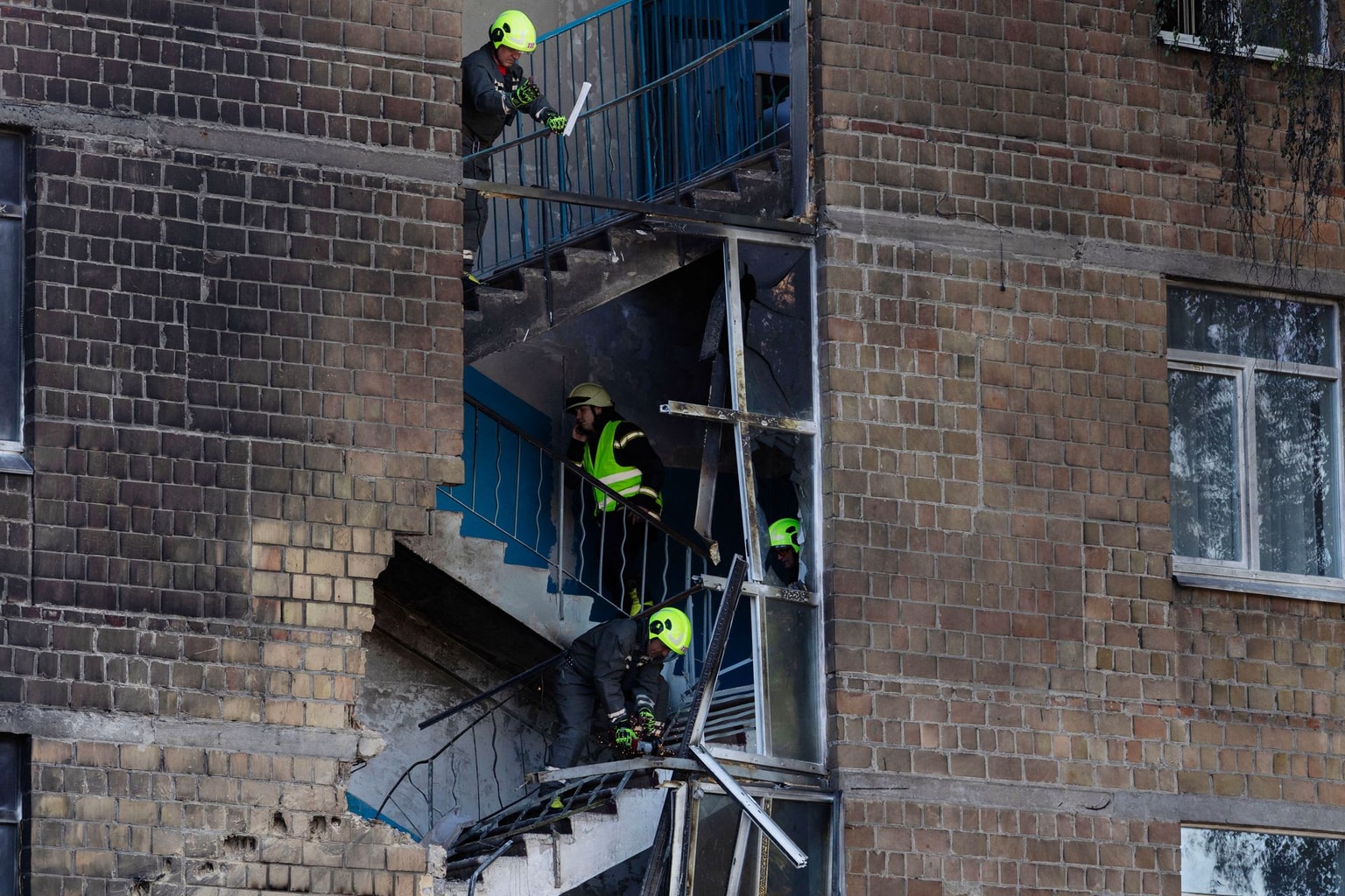 Rescuers work at a school damaged by a drone strike in Kyiv, Ukraine, on Oct. 1, 2026.