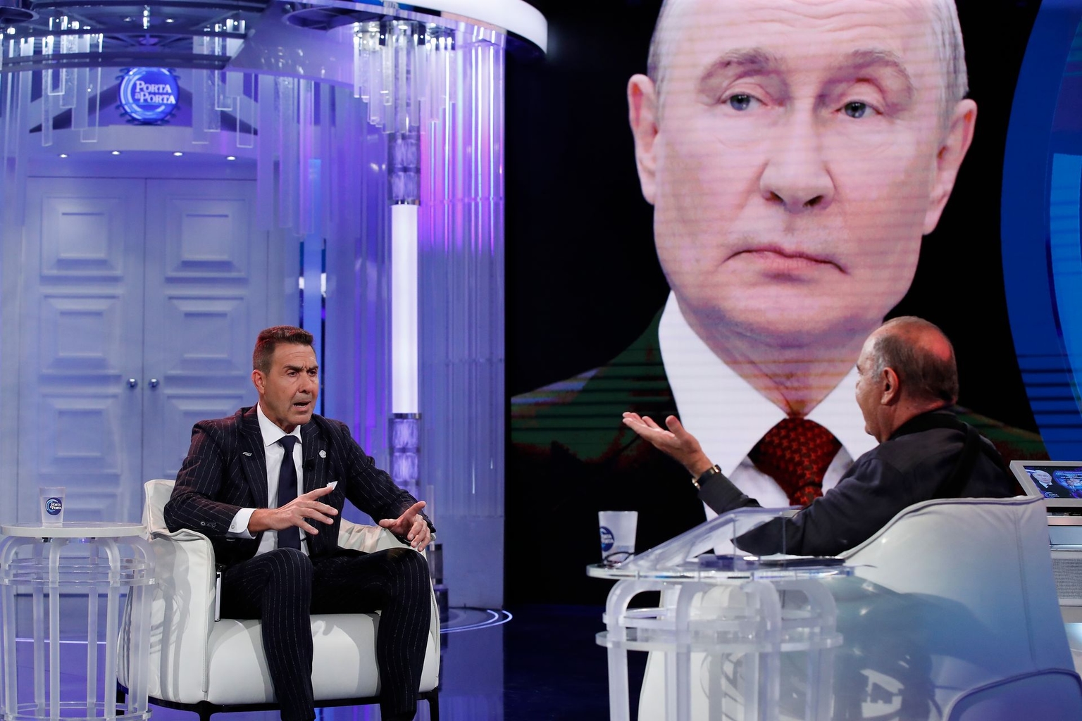 Futuro Nazionale President Roberto Vannacci (L) appears with host Bruno Vespa (R), with a background image of Vladimir Putin (C), in Rome, Italy, on Sept. 29, 2026.