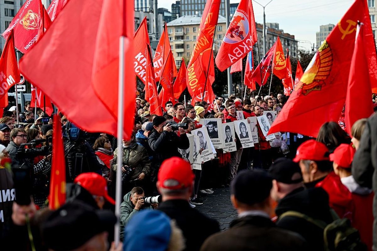 Supporters and members of the Communist Party of the Russian Federation (KPRF) march.