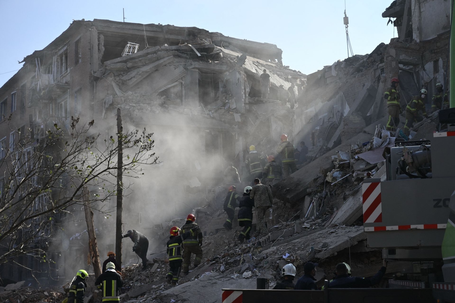 Rescuers conduct rescue operations at the site of a Russian strike on a residential building in Pryluky, Chernihiv Oblast, Ukraine, on Oct. 7, 2026.