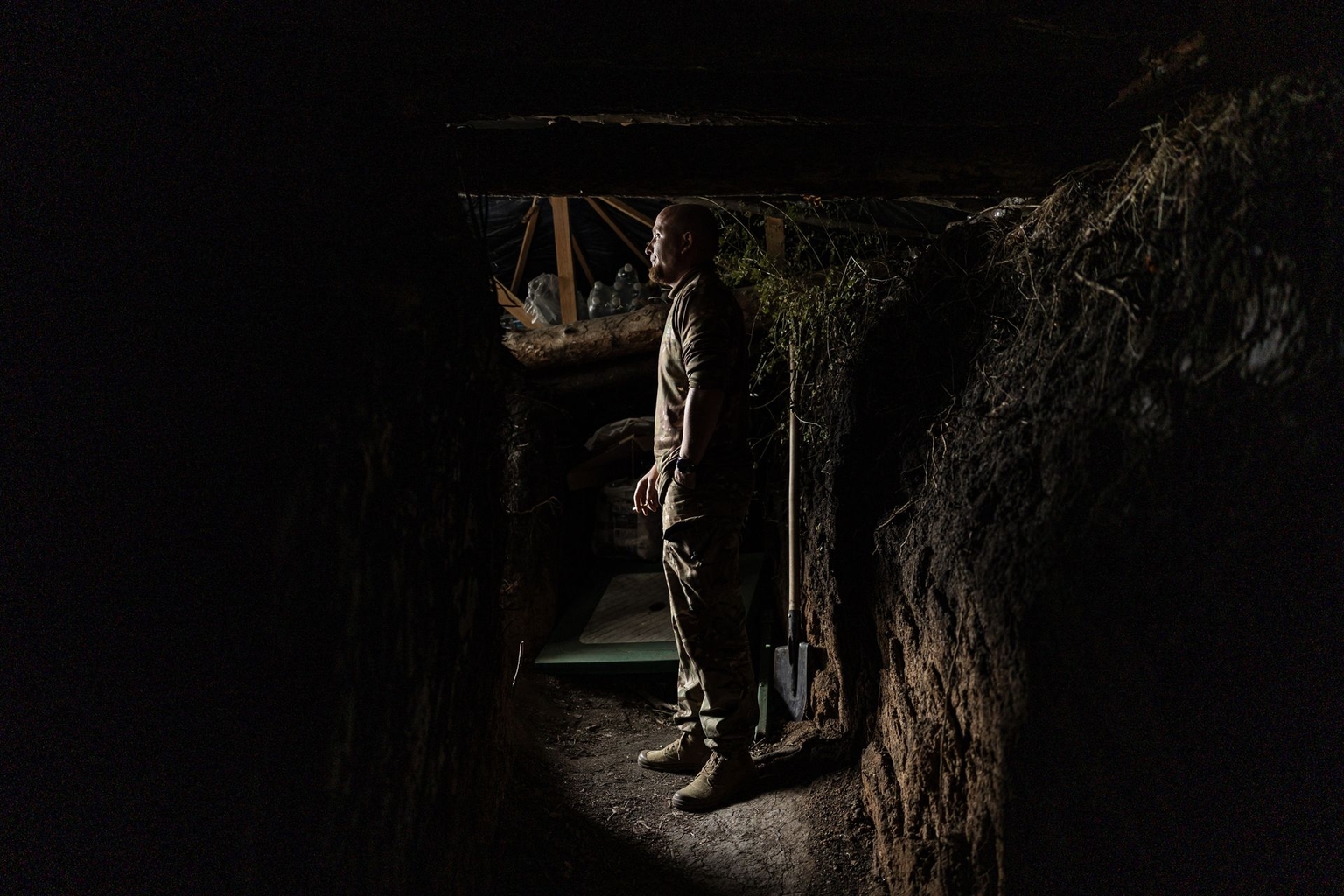 A Ukrainian soldier smokes at the entrance to a shelter belonging to an anti-drone unit in Donetsk Oblast, Ukraine, on Oct. 8, 2026.