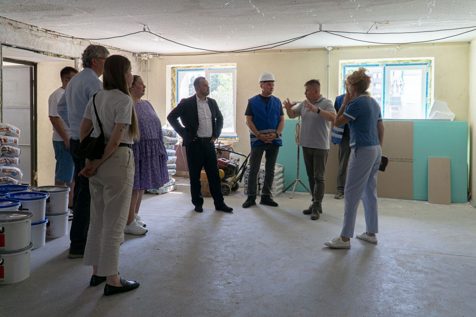 SUR project members stand inside a newly constructed building in Kremenchuk, Ukraine, on Dec. 2, 2025.
