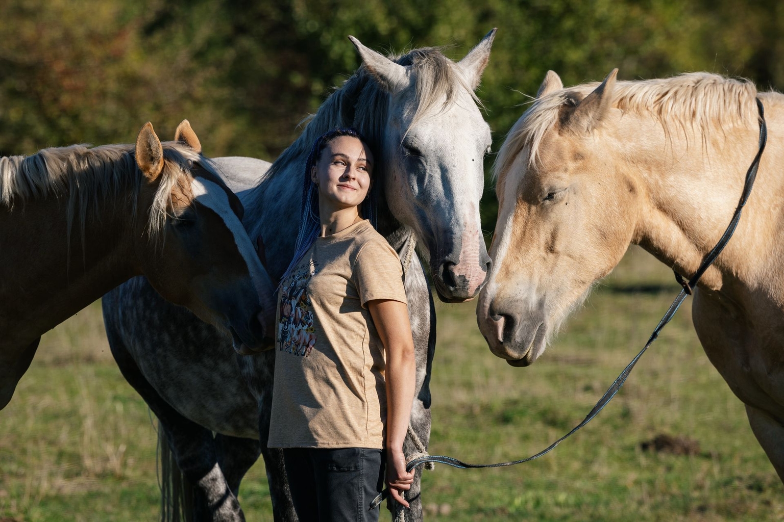 Marinka Hritsik stands with her three horses in Chernihiv, Ukraine, on Sept. 30, 2026.