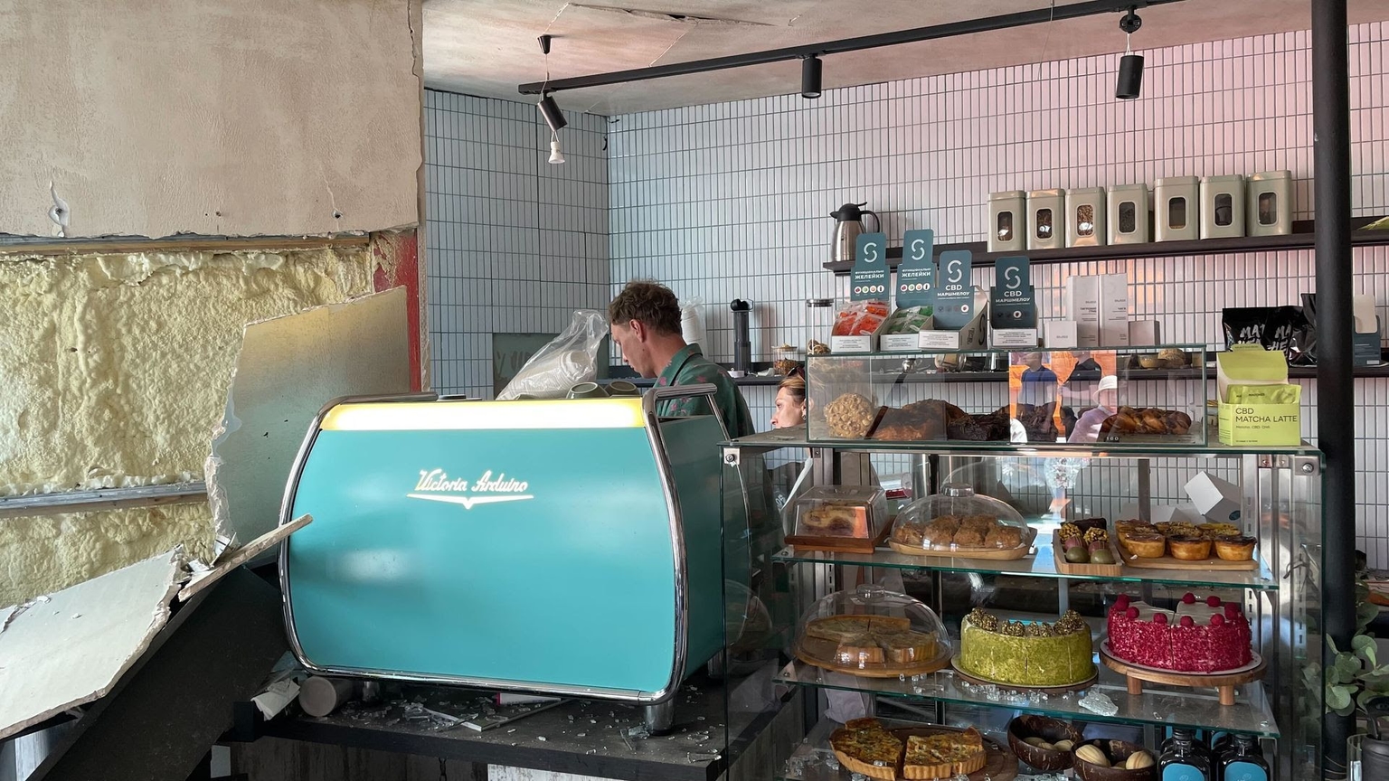 Yevhen Prusak and Olena Saenko, co-owners of the Hogo coffee shop damaged by a Russian missile strike on May 24, 2026. (Kateryna Hodunova/Kyiv Independent)