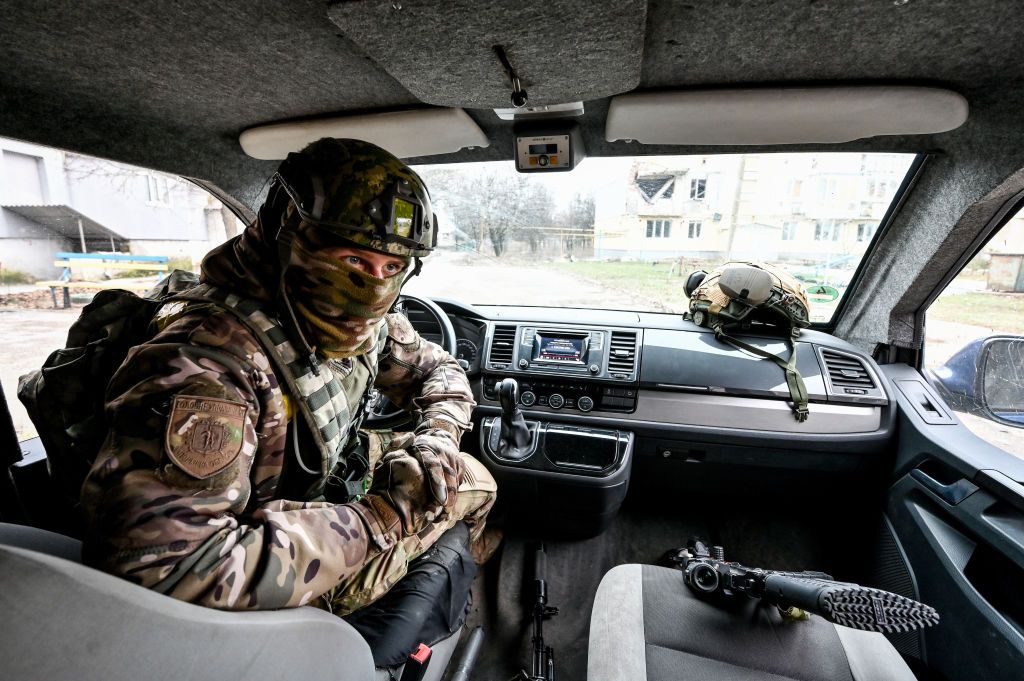 A Ukrainian soldier sits at the wheel of a car in Huliaipole, Zaporizhzhia Oblast, in January.