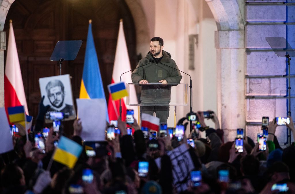 Ukraine's President Volodymyr Zelensky speaks in front of the crowd outside of the Royal Castle