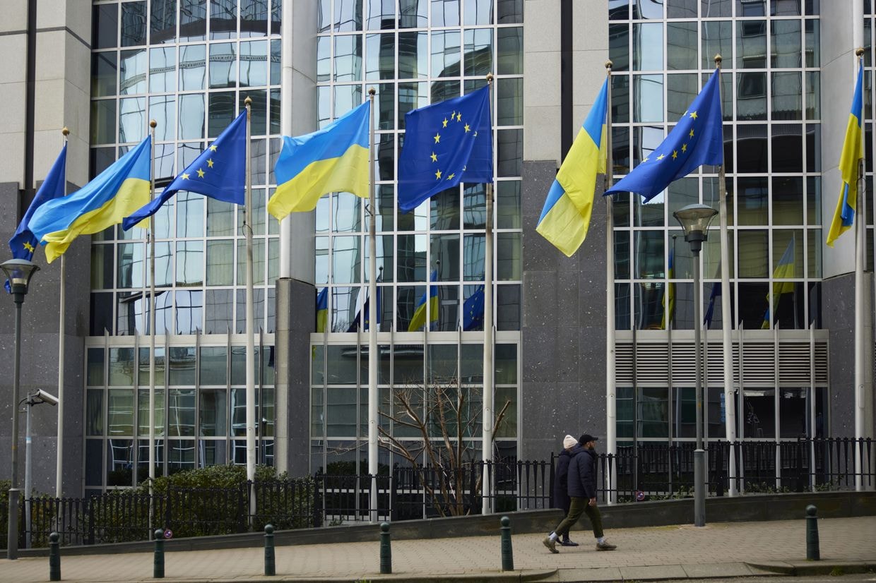 The flags of the European Union and Ukraine outside in Brussels, Belgium, on Feb. 24, 2023. (Ksenia Kuleshova/Bloomberg via Getty Images)