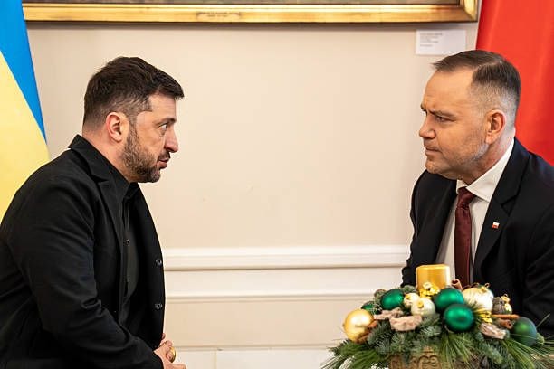 Karol Nawrocki, Poland's president, right, and Volodymyr Zelensky, Ukraine's president, at the Presidential Palace in Warsaw, Poland, on Friday, Dec. 19, 2025. At a pivotal summit in Brussels, European leaders agreed to provide Ukraine with a 90 billion euros loan to support its military and economic needs over the next two years. (Damian Lemanski/Bloomberg via Getty Images)